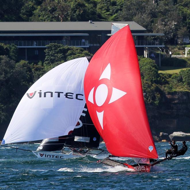 Race 1 – Noakesailing is challenged by Vintec for second place on the spinnaker run down the middle of Sydney Harbour – 18ft Skiffs NSW Championship ©  Frank Quealey / Australian 18 Footers League